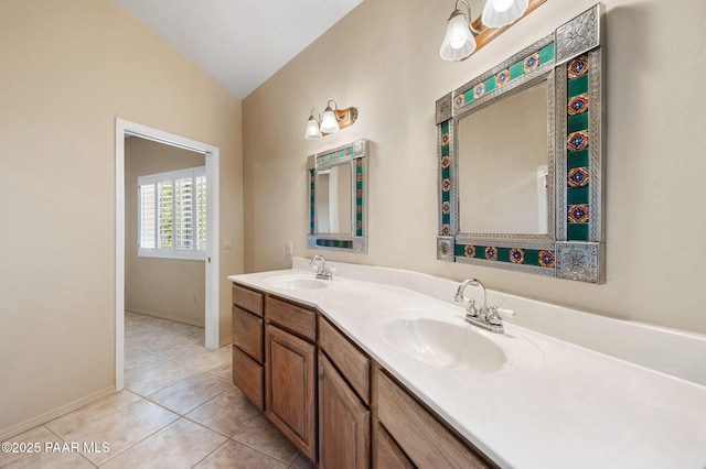18900 N Butte Pass Rd, Prescott, AZ 86305 - full bathroom featuring vaulted ceiling, tile patterned flooring, double vanity, and baseboards