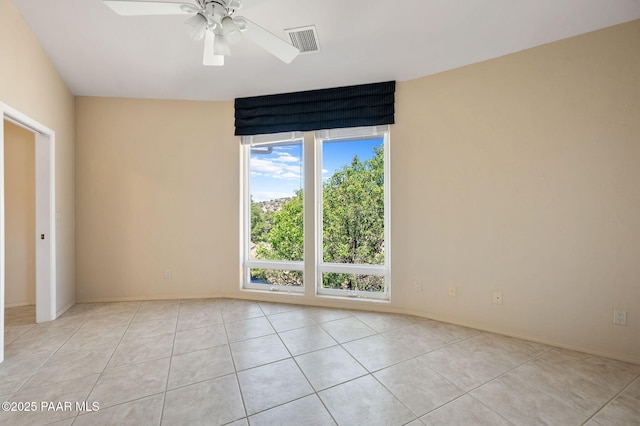 18900 N Butte Pass Rd, Prescott, AZ 86305 - empty room featuring light tile patterned flooring, a ceiling fan, and baseboards