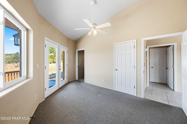 18900 N Butte Pass Rd, Prescott, AZ 86305 - unfurnished room featuring light colored carpet, a ceiling fan, high vaulted ceiling, and french doors