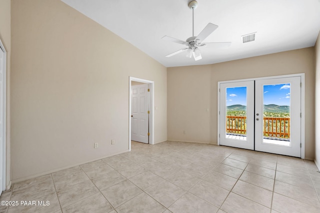 18900 N Butte Pass Rd, Prescott, AZ 86305 - spare room with lofted ceiling, light tile patterned floors, a ceiling fan, french doors, and baseboards