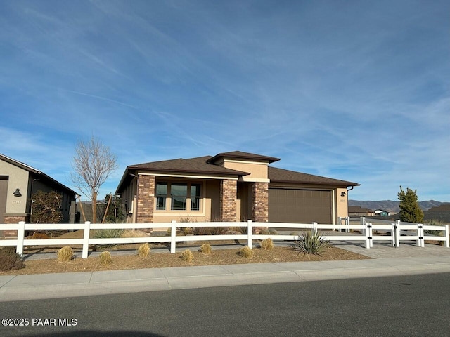 view of front of house with a mountain view and a garage