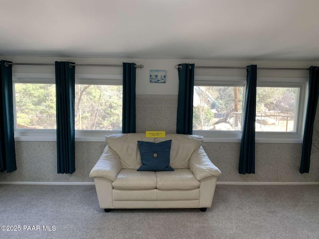 sitting room featuring a healthy amount of sunlight, carpet flooring, and wallpapered walls