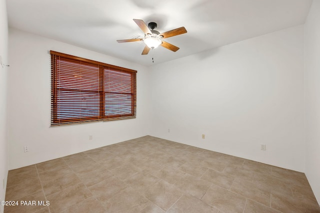 unfurnished room with ceiling fan