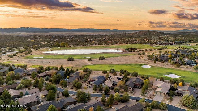 aerial view at dusk with a water and mountain view