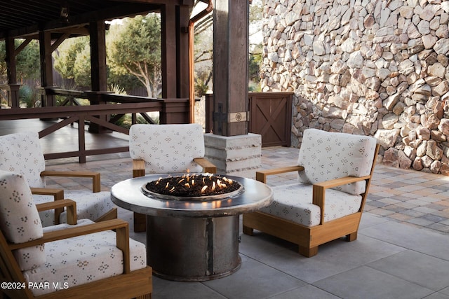 view of patio featuring a fire pit