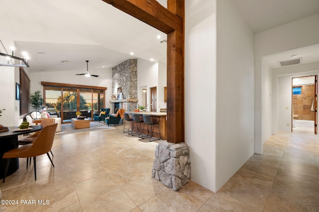 hallway featuring lofted ceiling with beams