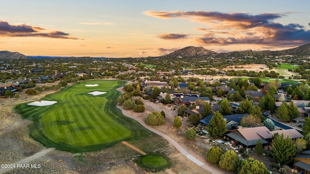 aerial view at dusk featuring a mountain view