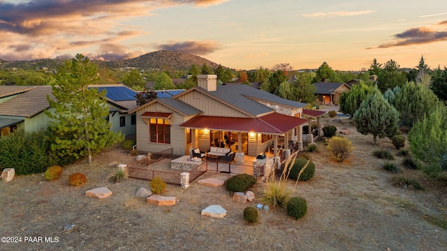 exterior space with a mountain view and a patio