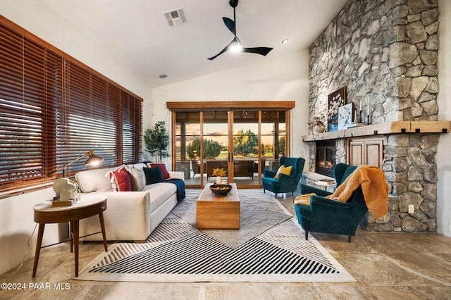 living room featuring a wealth of natural light, a fireplace, ceiling fan, and high vaulted ceiling