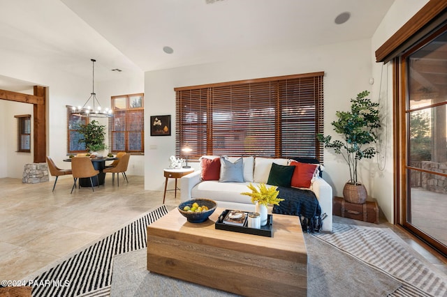 living room featuring a notable chandelier