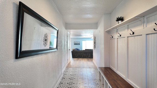 477 W State Route 260, Camp Verde, AZ 86322 - mudroom with a textured ceiling, baseboards, a textured wall, and tile patterned flooring