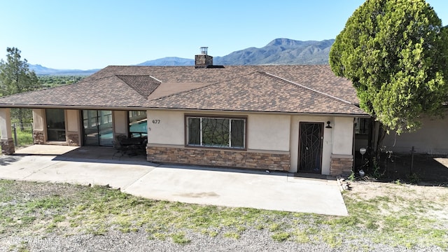 477 W State Route 260, Camp Verde, AZ 86322 - ranch-style home featuring a shingled roof, a mountain view, stucco siding, and stone siding
