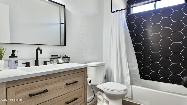 477 W State Route 260, Camp Verde, AZ 86322 - bathroom featuring toilet, a textured wall, shower / bathtub combination with curtain, and vanity