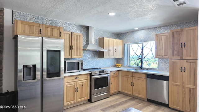 477 W State Route 260, Camp Verde, AZ 86322 - kitchen with wall chimney range hood, a textured ceiling, appliances with stainless steel finishes, a sink, and light countertops