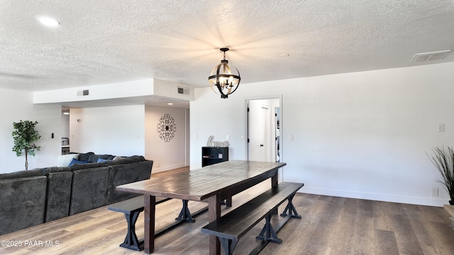 477 W State Route 260, Camp Verde, AZ 86322 - dining area with a textured ceiling, visible vents, wood finished floors, and an inviting chandelier