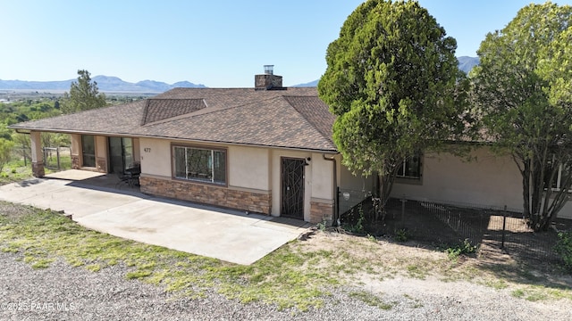 477 W State Route 260, Camp Verde, AZ 86322 - single story home with fence, a patio, a shingled roof, stone siding, and stucco siding