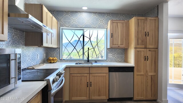 477 W State Route 260, Camp Verde, AZ 86322 - kitchen with light countertops, wall chimney exhaust hood, decorative backsplash, and stainless steel appliances