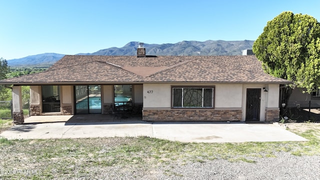 477 W State Route 260, Camp Verde, AZ 86322 - ranch-style house featuring stone siding, stucco siding, a mountain view, a chimney, and a patio area