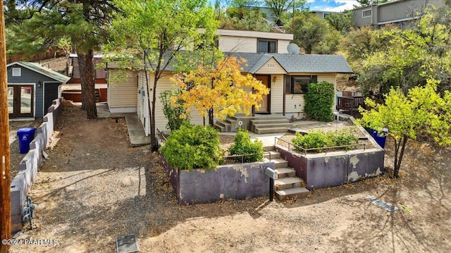 view of front of home featuring an outbuilding