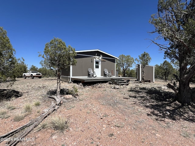 exterior space featuring a wooden deck