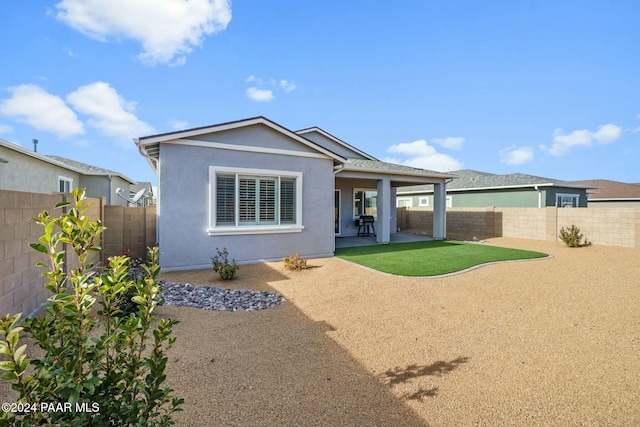 back of house featuring a patio