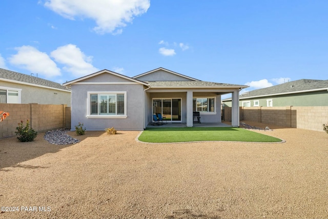 back of property featuring a patio