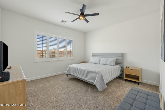 bedroom featuring ceiling fan and light colored carpet