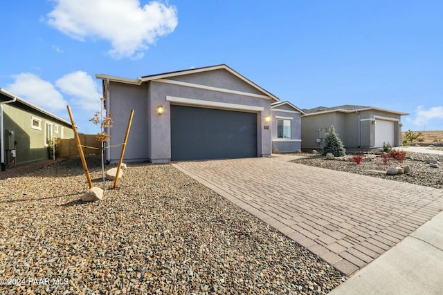 single story home with a garage