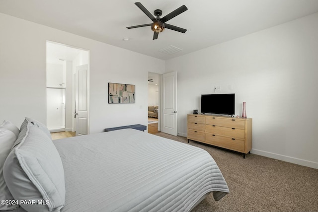 bedroom with ceiling fan and light colored carpet