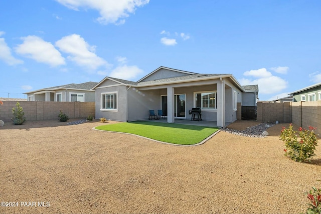 rear view of property with a patio area