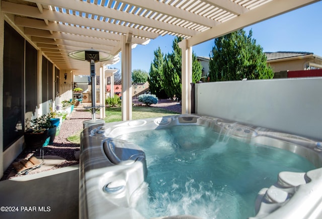 view of swimming pool featuring a pergola and a hot tub