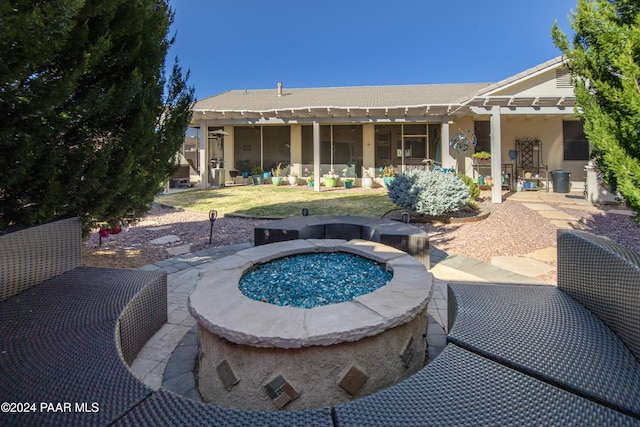 view of pool featuring a patio and an outdoor fire pit