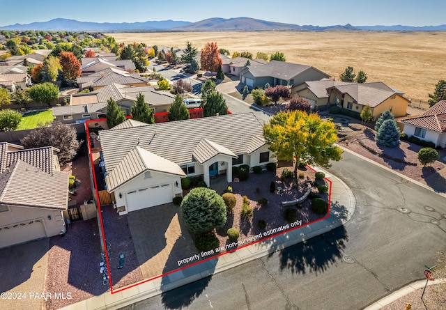 drone / aerial view featuring a mountain view