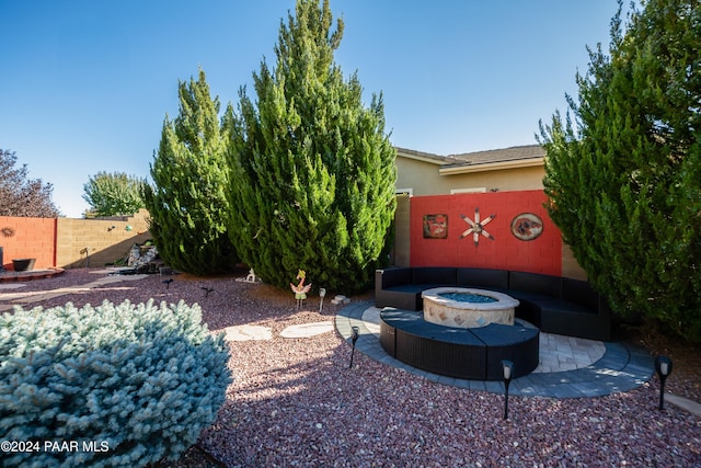 view of yard with a fire pit