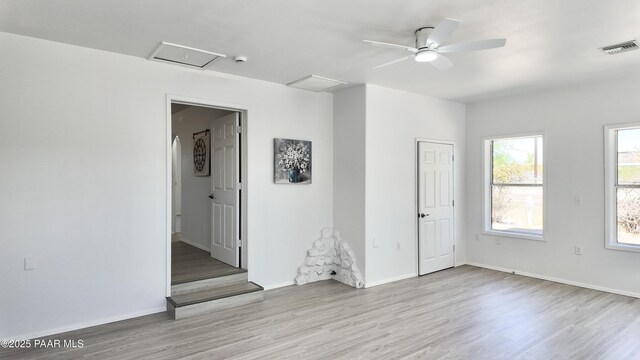 5640 N Burke Blvd, Rimrock, AZ 86335 - empty room featuring attic access, wood finished floors, baseboards, a smoke detector, and ceiling fan