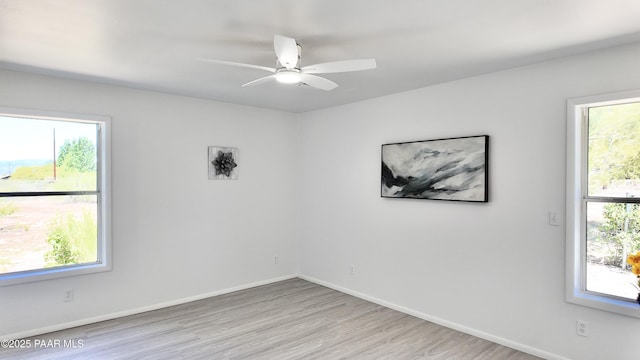 5640 N Burke Blvd, Rimrock, AZ 86335 - empty room with light wood-type flooring, a ceiling fan, and baseboards