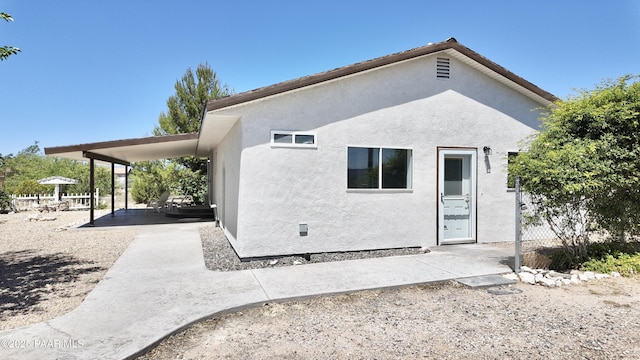 5640 N Burke Blvd, Rimrock, AZ 86335 - rear view of property featuring stucco siding, a patio area, and fence