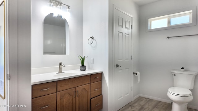 5640 N Burke Blvd, Rimrock, AZ 86335 - bathroom with toilet, vanity, wood finished floors, and baseboards
