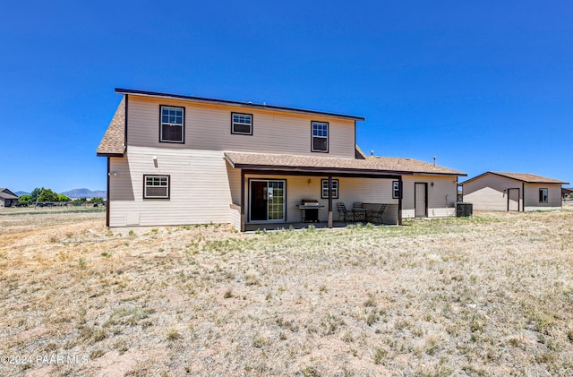 rear view of house featuring a patio