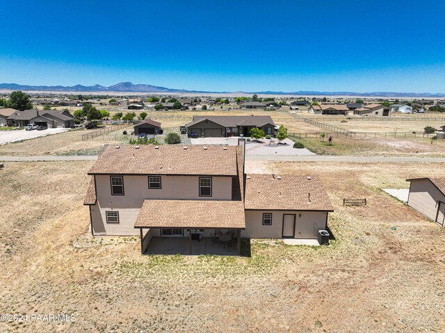 birds eye view of property featuring a mountain view