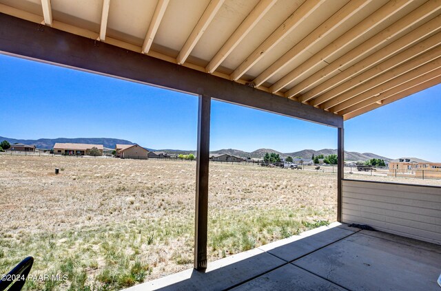 view of patio / terrace featuring a mountain view