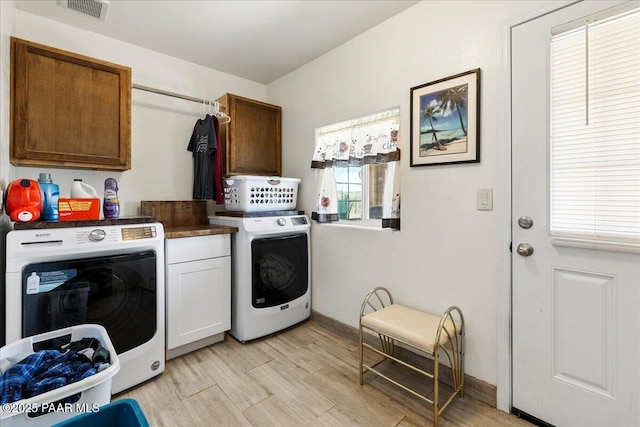 2354 N Kachina Ln, Chino Valley, AZ 86323 - laundry area with visible vents, cabinet space, baseboards, and light wood-style floors