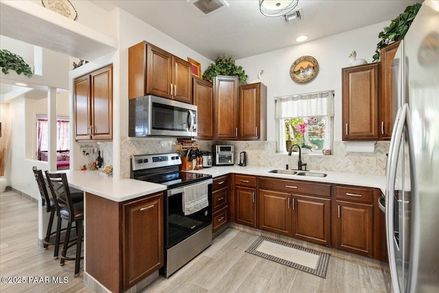 2354 N Kachina Ln, Chino Valley, AZ 86323 - kitchen with appliances with stainless steel finishes, a healthy amount of sunlight, a sink, and visible vents