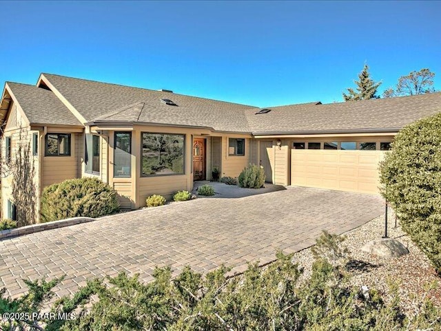 ranch-style house featuring a garage