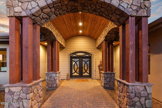 view of exterior entry with stone siding