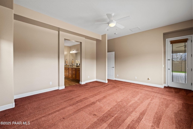 empty room featuring a ceiling fan, baseboards, and carpet floors