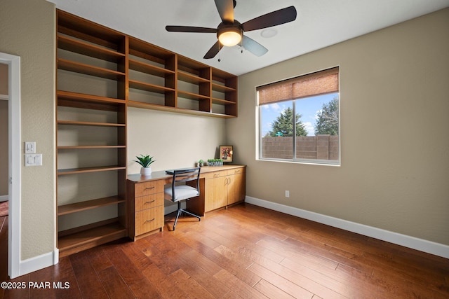 office featuring ceiling fan, baseboards, and hardwood / wood-style flooring