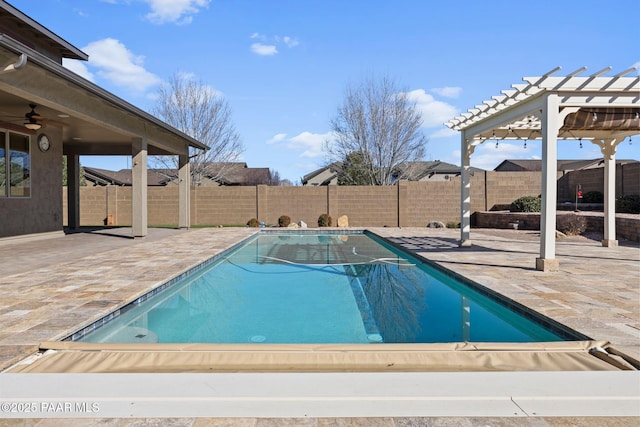 view of swimming pool with a patio area, a pergola, and a fenced backyard