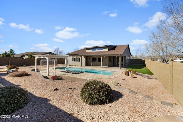 view of swimming pool with a patio, a fenced backyard, and a pergola