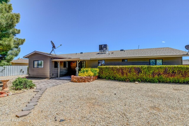 back of house featuring central air condition unit, fence, and a patio